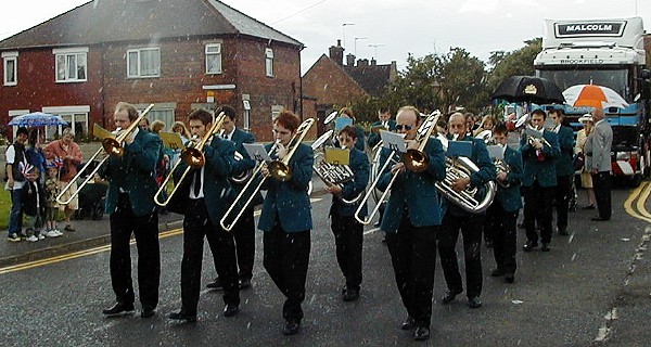 Procession starts in rain